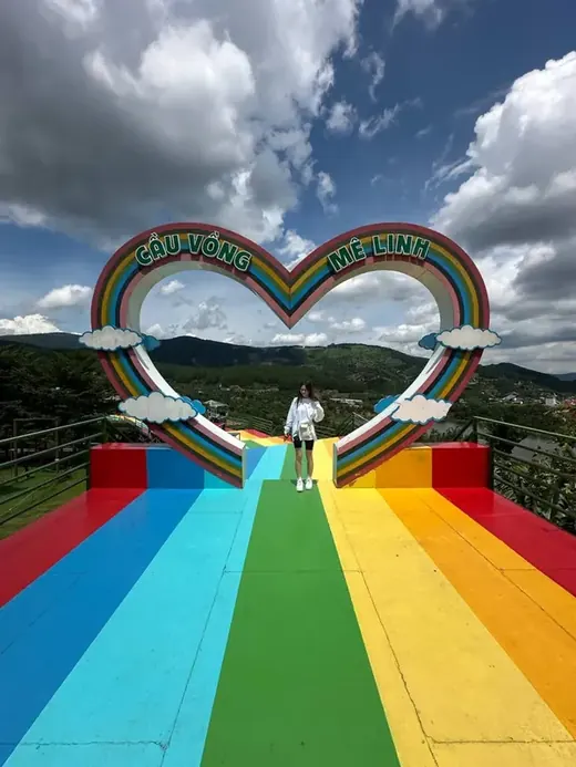 Kate on a rainbow bridge in Vietnam